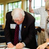 President Emeritus Don and Nancy Lubbers looking at books at the Retiree Reception.